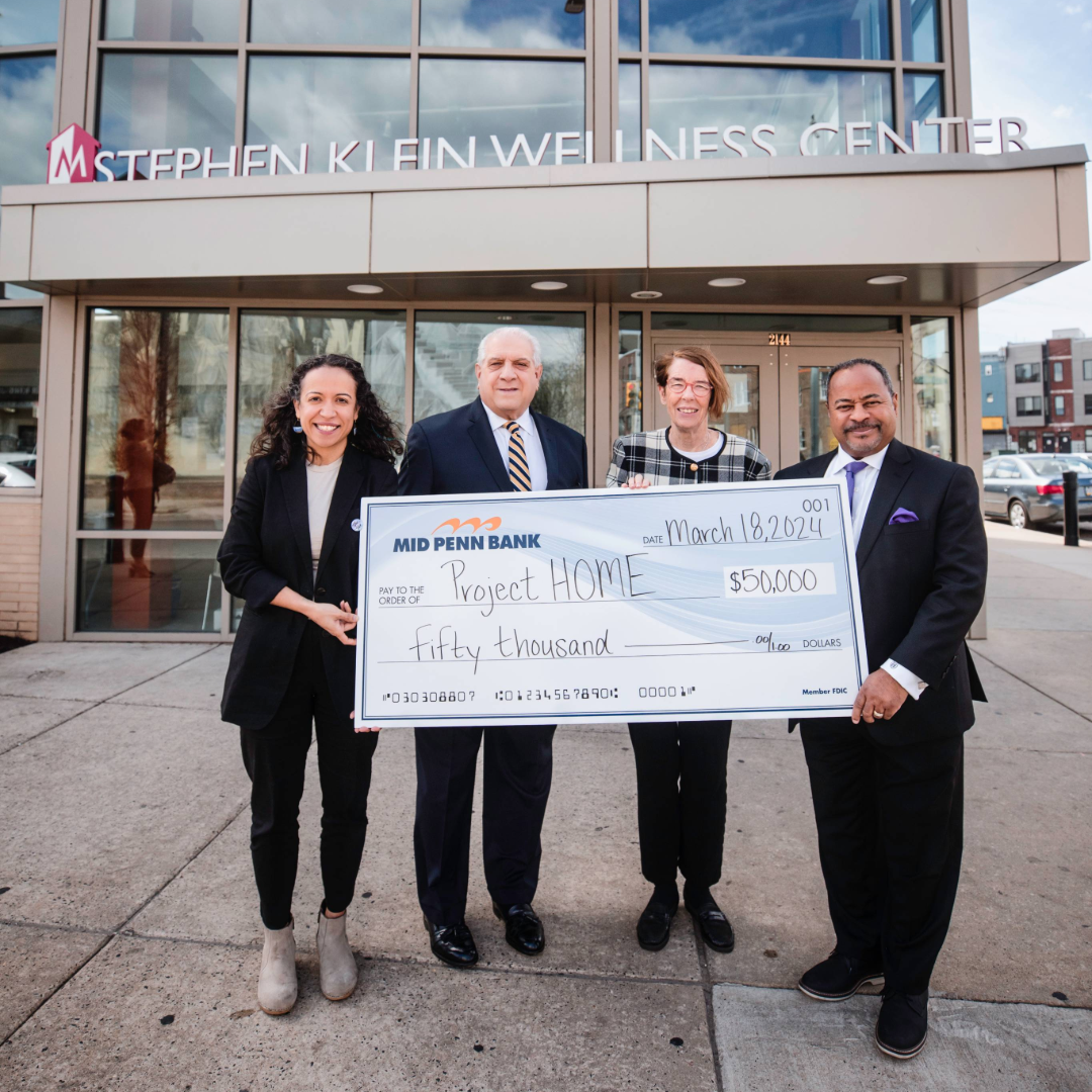 Mid Penn Bank representatives presenting a donation in support of a local community organization.