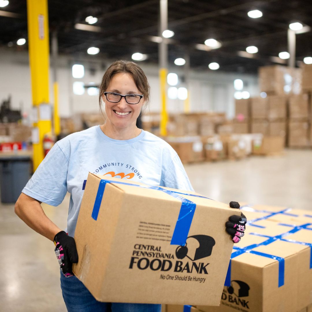 Mid Penn Bank employee volunteering at a local food bank.