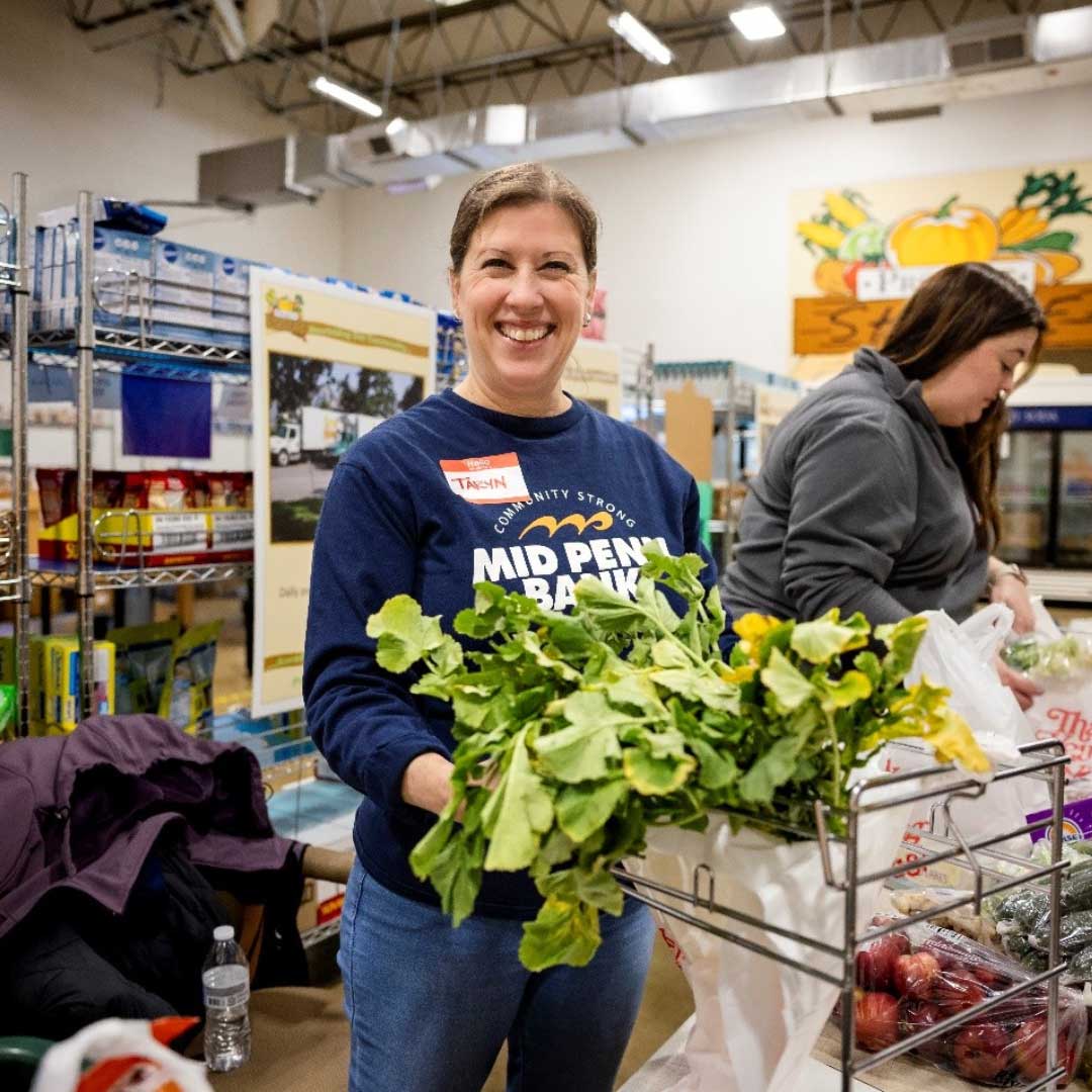 Mid Penn Bank employees volunteering to support local food distribution efforts.