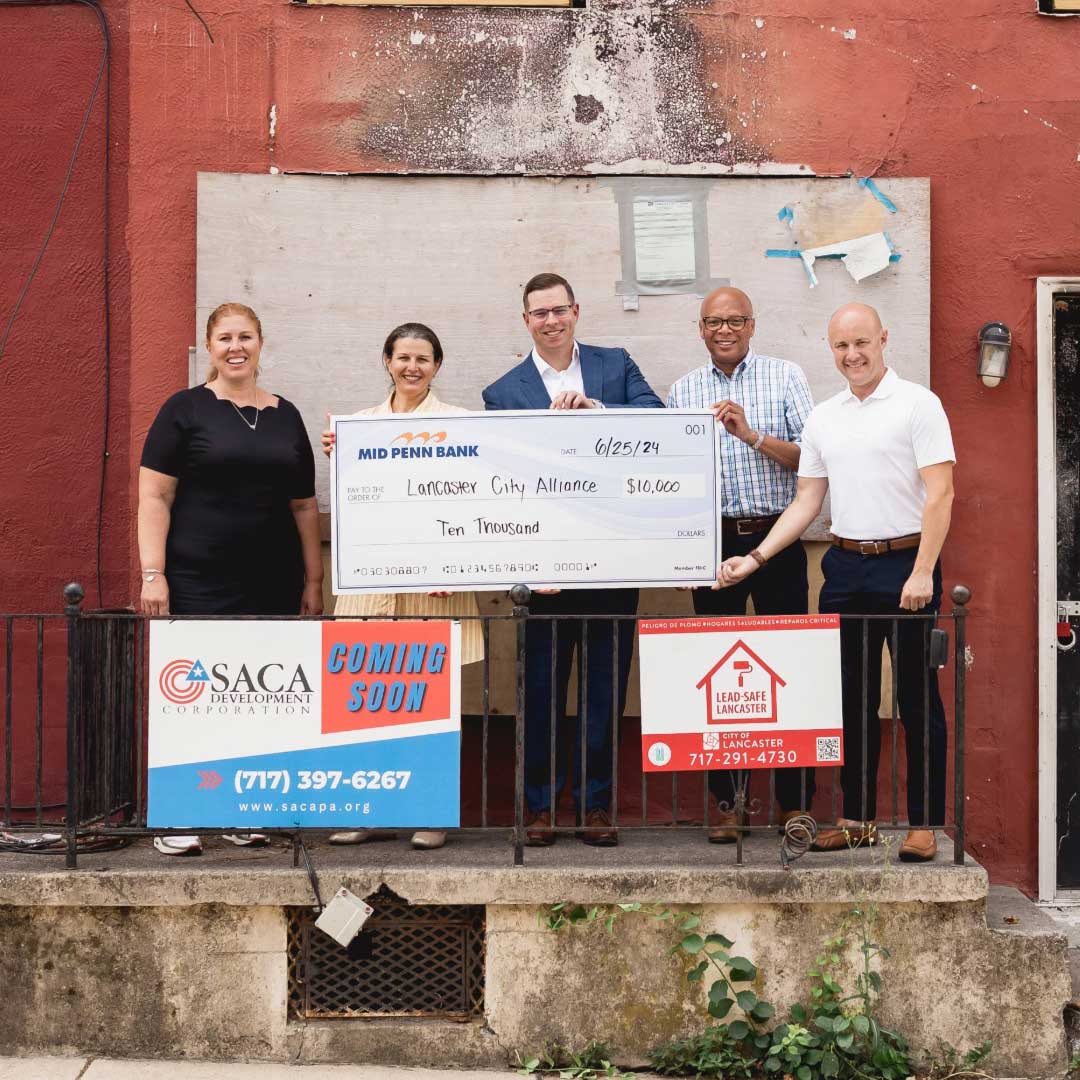 Mid Penn Bank representatives presenting a donation of $10,000 in support of local economic development and community revitalization efforts.